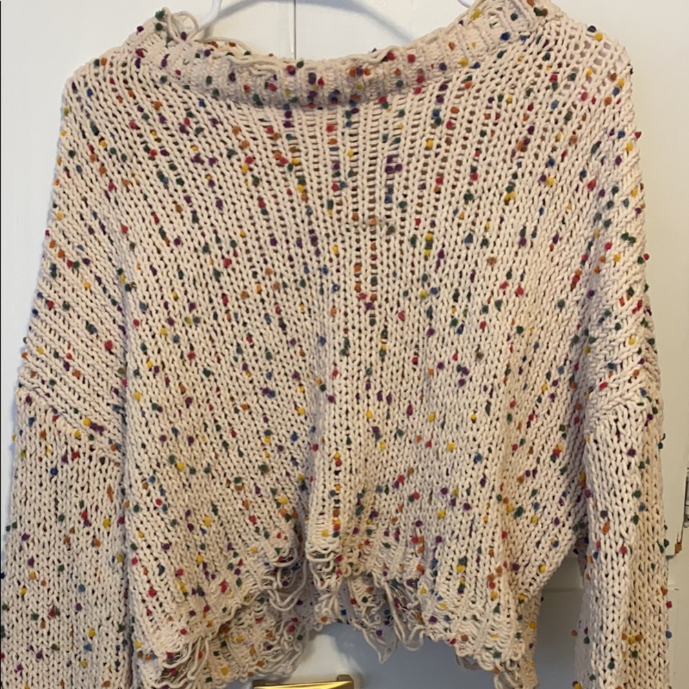 Distressed speckled sweater